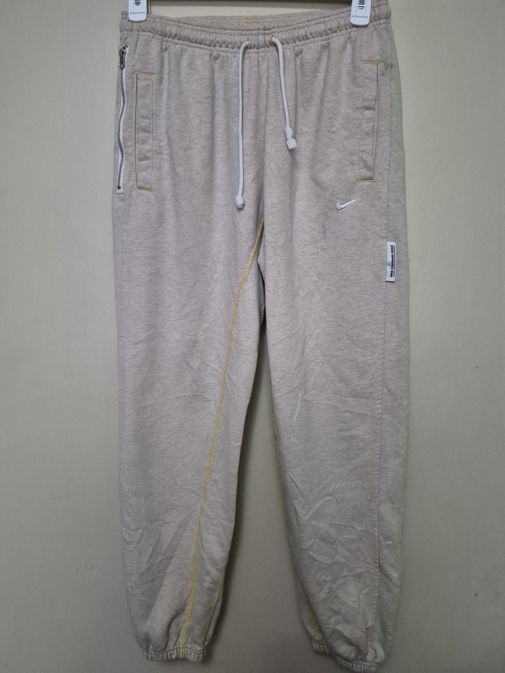 Nike Light Beige Drawstring Joggers with Yellow Stitching